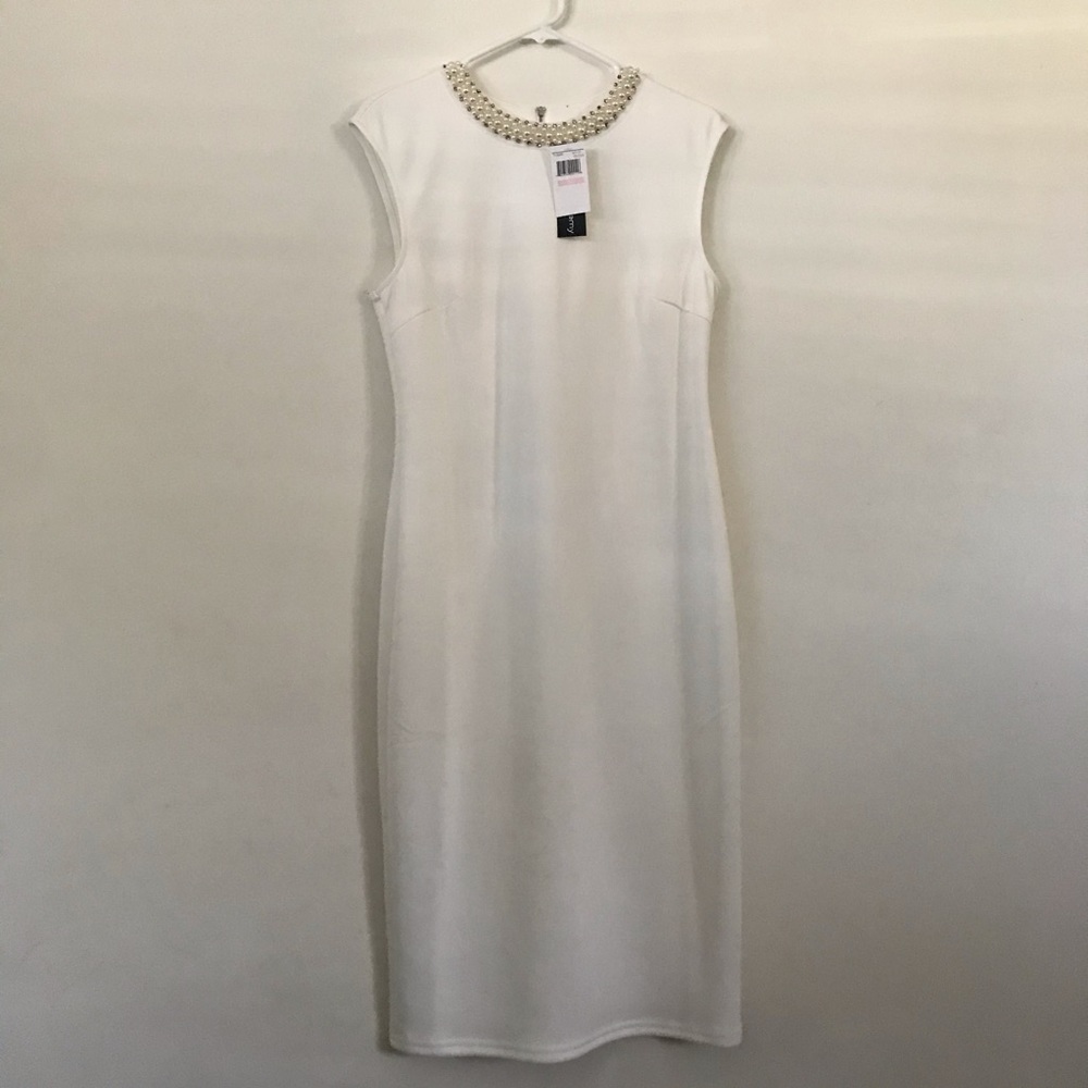 *Simple elegant white dress with pearls